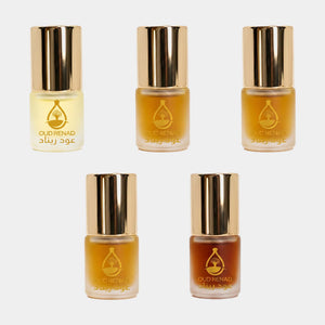 Amber Samples perfume oil set with warm golden fragrance oils and elegant Oud Renad packaging