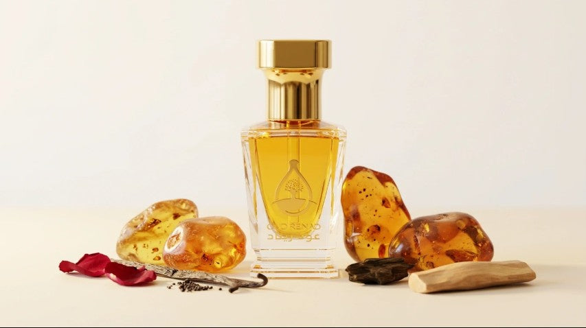Cosy winter perfume UK by OUD Renad displayed with golden amber, vanilla, rose petals and sandalwood.